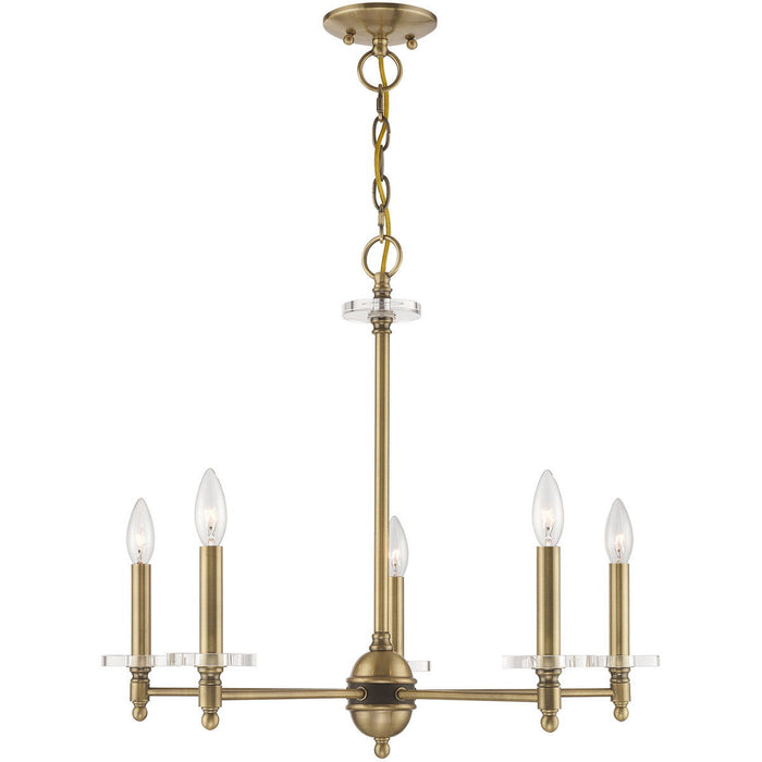 Five-light metal chandelier with shades in antiqued brass finish, featuring clear glass shades and dimmable lighting by HomeRoots.