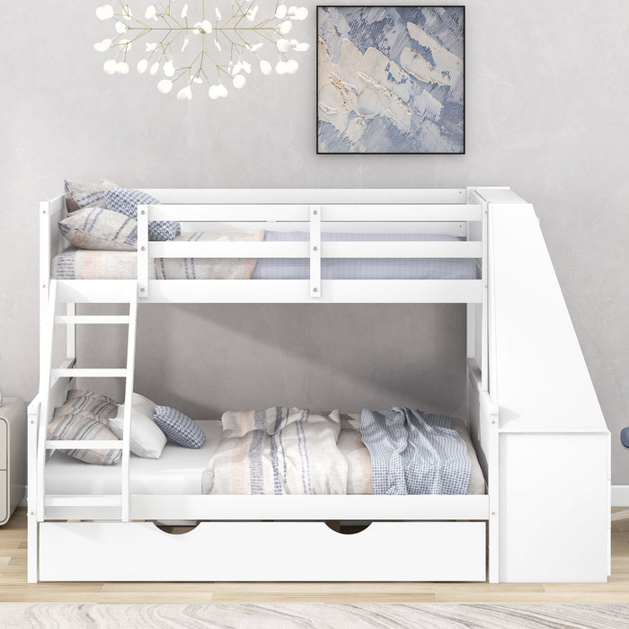 Giga bunk bed with built-in desk, trundle, three storage drawers, and a shelf, shown in a cozy bedroom setting.