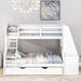 Giga bunk bed with built-in desk, trundle, three storage drawers, and a shelf, shown in a cozy bedroom setting.