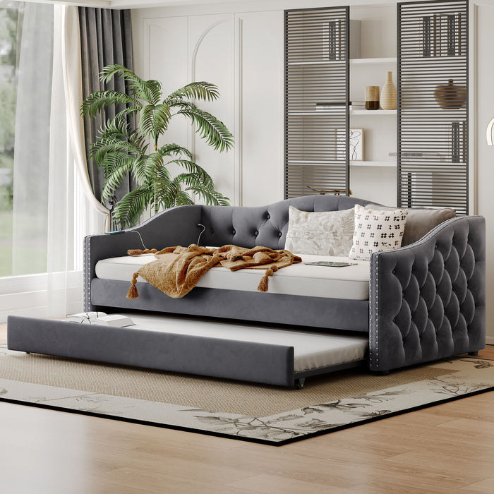 Gray Giga twin size upholstered daybed with trundle and USB charging port, perfect for bedroom relaxation and extra sleeping space.