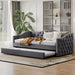 Gray Giga twin size upholstered daybed with trundle and USB charging port, perfect for bedroom relaxation and extra sleeping space.