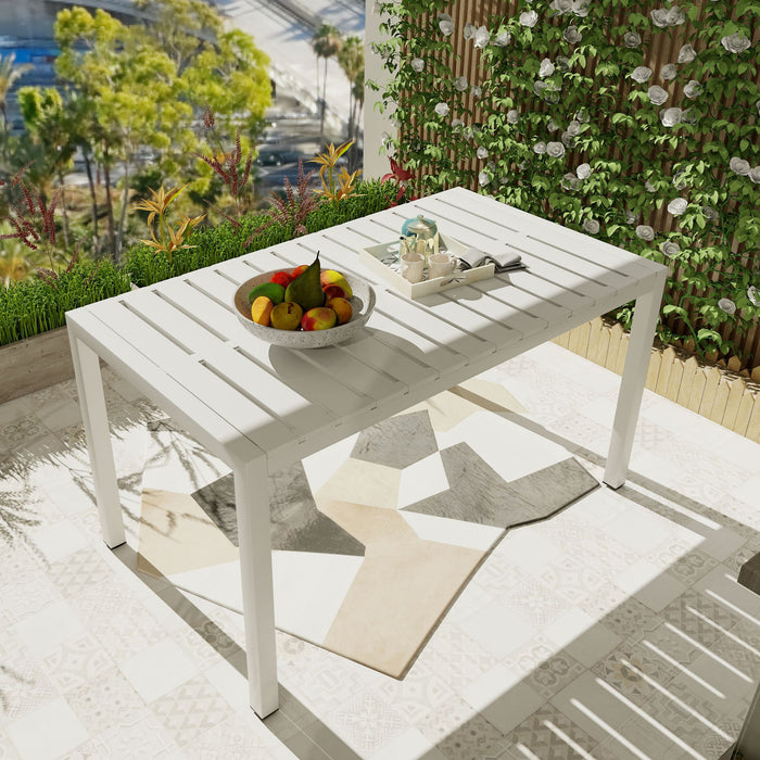 Giga modern long dining table with UV resistant PP tabletop and rust-proof powder-coated metal legs in snow white finish.