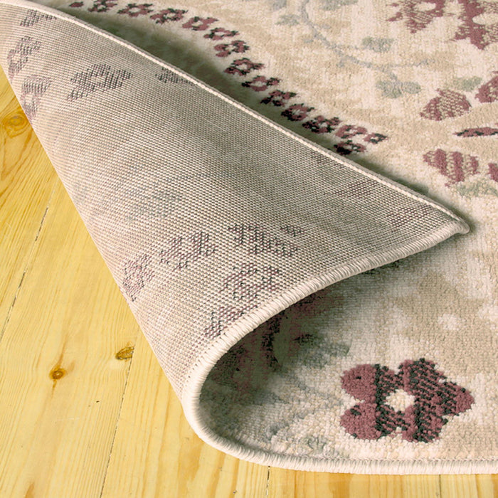 9' x 12' Floral Power Loom Distressed Stain Resistant Area Rug - Ivory