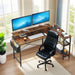Giga black and brown L-shaped gaming desk with monitor stand, power outlets, and storage shelves in a corner workspace setup.