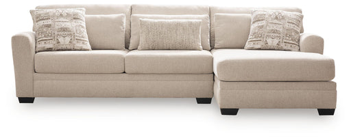 Benchcraft® Mandi Point 2-piece stationary sectional sofa with plush cushions and modern design, shown in a cozy living room setting.
