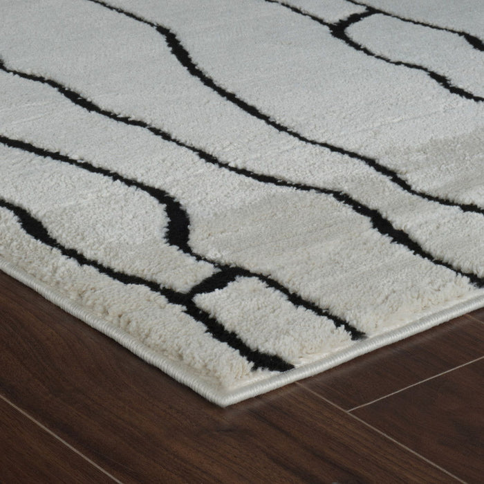 8' x 11' Abstract Distressed Area Rug - Cream And Black