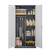 Gray Giga wardrobe with hanging rod, compartments, and lockable doors with keys, designed for bedroom storage.