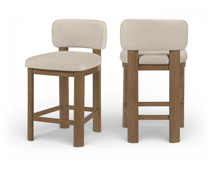 Pair of Meridian Furniture Paloma faux leather counter stools with brown frames, upholstered seats, and modern design.