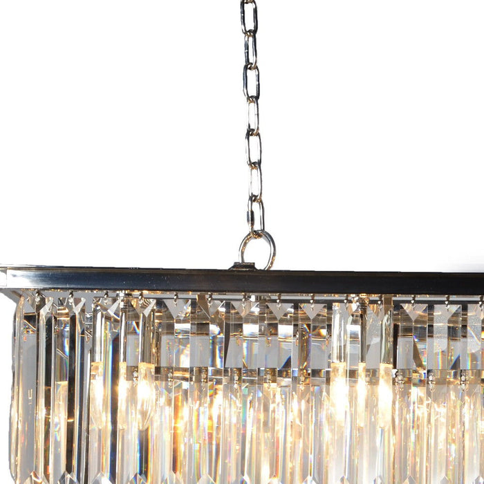 Black metal chandelier with eight lights, crystal accents, and shades, designed as a statement piece for elegant home lighting.