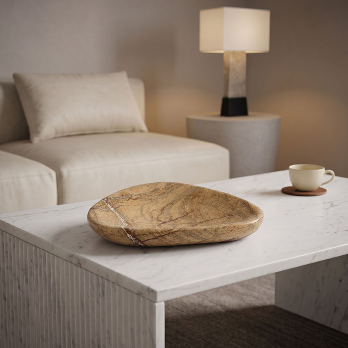 Marble bowl from Meridian Furniture's Whelan collection, showcasing smooth white marble with natural veining, used as a decorative dish.