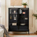 Giga modern minimalist LED display cabinet with tempered glass door and metal legs, showcasing interior shelves and lighting.