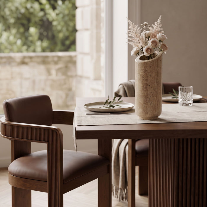 Elegant Lochlan Travertine Vase by Meridian Furniture, showcasing its textured stone surface and modern design for home decor.
