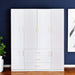 White 74-inch carved geometric six-door wardrobe with three drawers by HomeRoots, featuring intricate patterns and modern design.