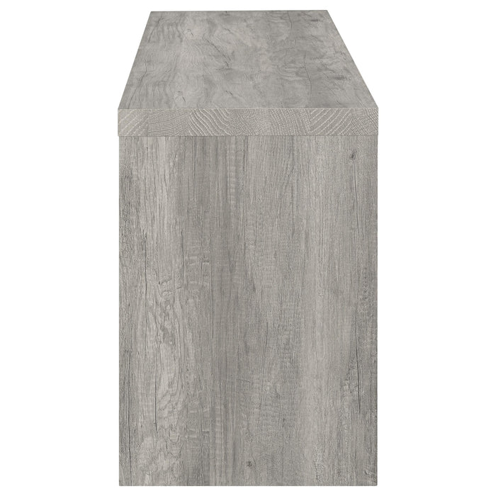 Grey driftwood CoasterEveryday Burke 3-piece 59-inch TV entertainment center with open shelves and storage cabinets.