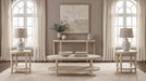 Lucaire round cultured marble top end table by CoasterEveryday in honed cream and sandstone tones