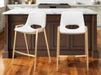 Set of two white faux leather and steel low back counter height bar chairs with gold accents by HomeRoots