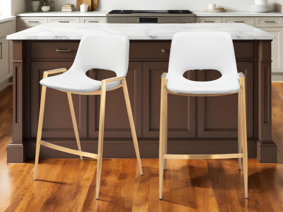 Set of two white faux leather and steel low back counter height bar chairs with gold accents by HomeRoots