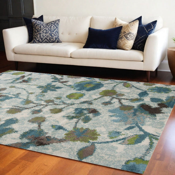 10' x 13' Machine Woven Floral Indoor Area Rug - Teal Blue