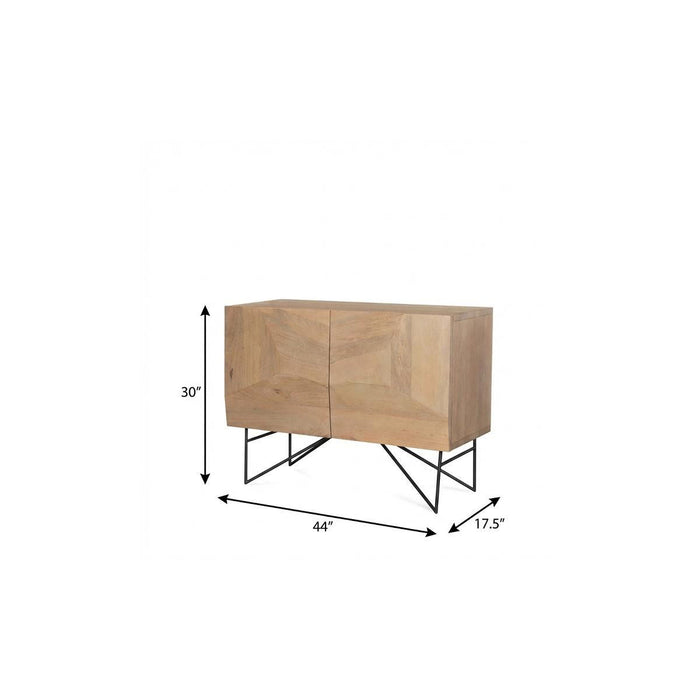 Natural wood and metal accent cabinet with carved geometric patterns, two doors, in a 44-inch size, by HomeRoots.