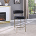 Set of 2 Giga modern Sherpa counter height barstools with brushed brass legs, upholstered seats, footrests, and low backs for dining.