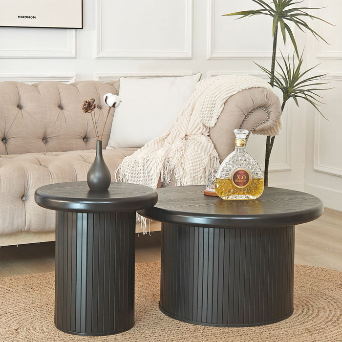 Set of two black Giga fluted cylinder side tables with round tops, ideal for living room decor and small space accents.