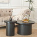 Set of two black Giga fluted cylinder side tables with round tops, ideal for living room decor and small space accents.