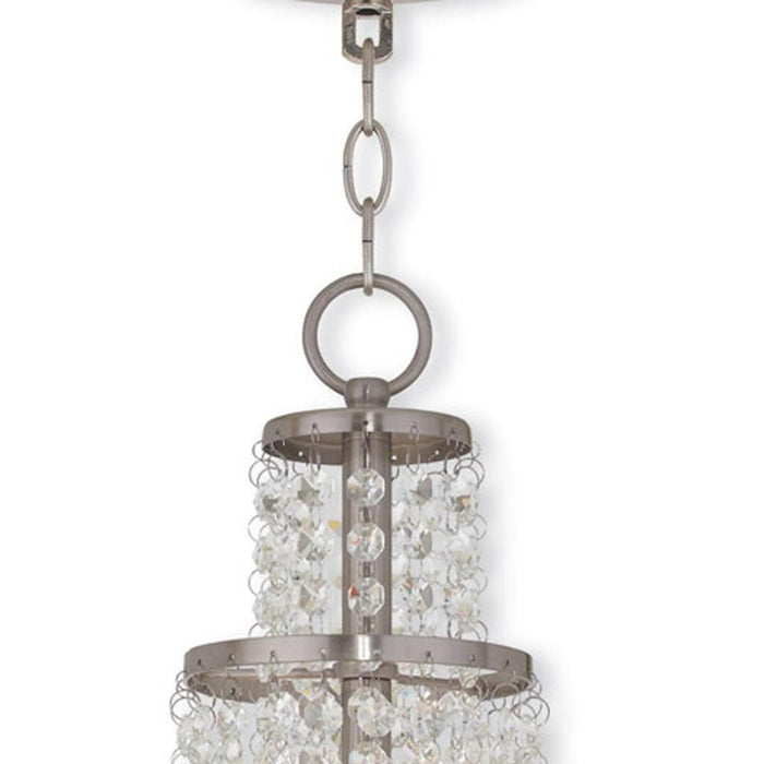 HomeRoots 22-inch metal chandelier with three shades, featuring dimmable lighting, nickel finish, clear and off-white shades.