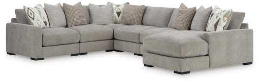 Benchcraft® Aslan Court 6-piece stationary sectional with plush cushions and modern design, shown in a spacious living room.