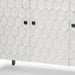 Gray and white 47-inch wood and metal carved geometric accent cabinet with three doors, modern HomeRoots design.