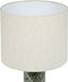 Meridian Furniture Titan textured fabric table lamp with a sleek design and neutral-colored shade on a wooden surface.
