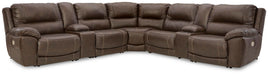 Dunleith Signature Design by Ashley® power reclining sectional with plush cushions and dark brown leather upholstery.