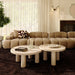 Pair of TOV Furniture Amora indoor/outdoor nesting accent tables with travertine tops and sleek metal bases, set of two.