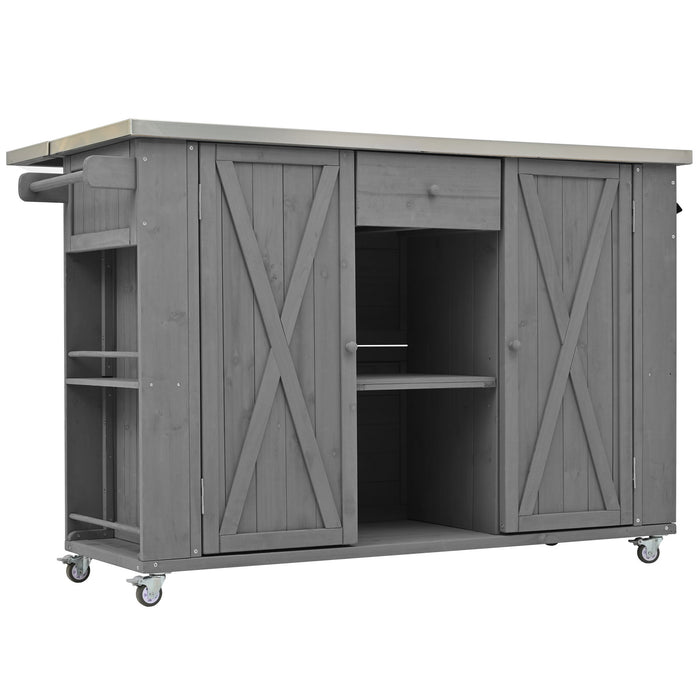 Giga outdoor kitchen island with stainless steel top, storage, towel and spice racks, and bottle opener in a backyard setting.