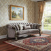 Gray velvet curved floral sofa with champagne legs and matching toss pillows, stylish stationary sofa by HomeRoots.
