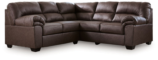 Signature Design by Ashley WillowBend stationary sectional sofa with plush cushions and modern design in a cozy living room setting.
