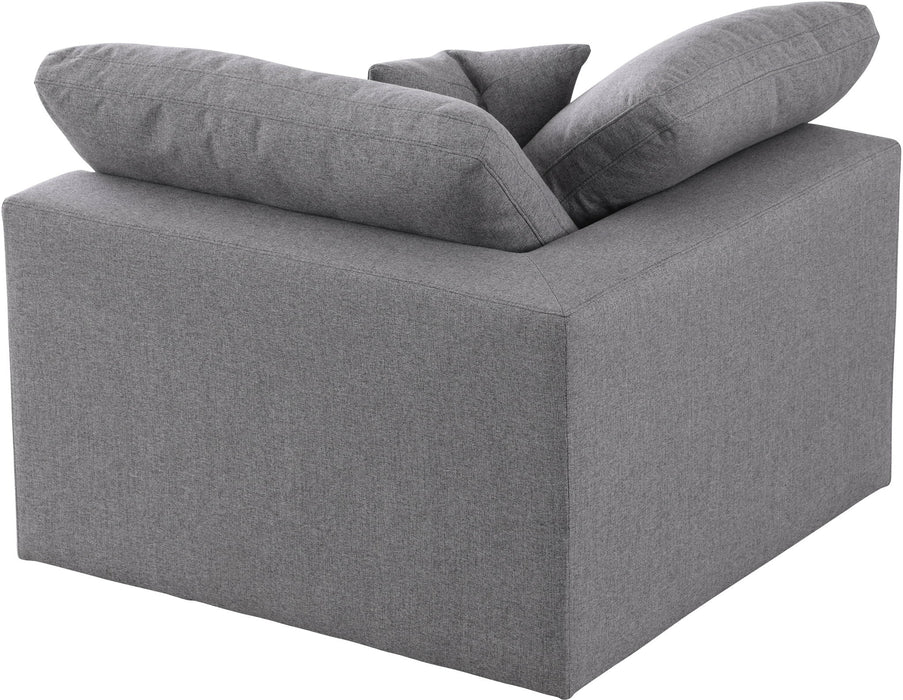 Corner chair from Meridian Furniture's Serene collection, featuring plush cushions and a modern design in a cozy living room setting.