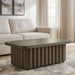 Rectangular cocktail table from the Darimore collection by Signature Design by Ashley® with a sleek wooden finish.