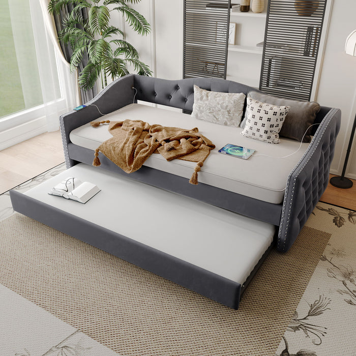 Gray Giga twin size upholstered daybed with trundle and built-in USB charging port, perfect for bedroom use.