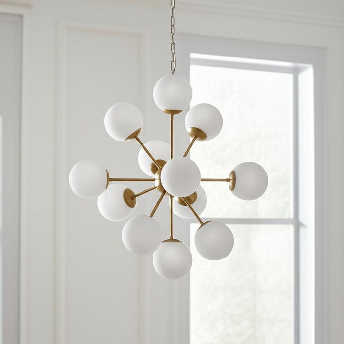 HomeRoots Sputnik Eleven chandelier with frosted glass shades, gold metal frame, and dimmable lighting for modern interior decor.