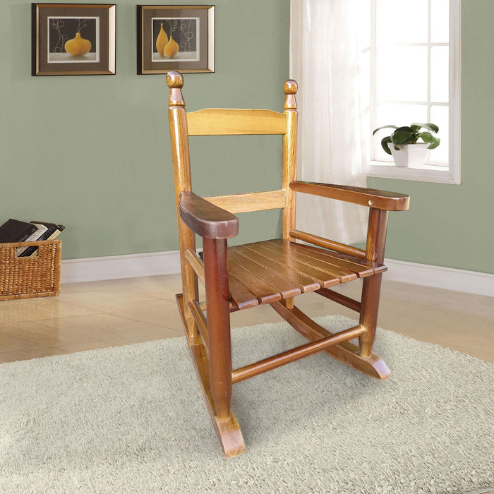 Giga children's indoor or outdoor rocking chair, durable and suitable for kids, with a wooden frame and colorful cushions.