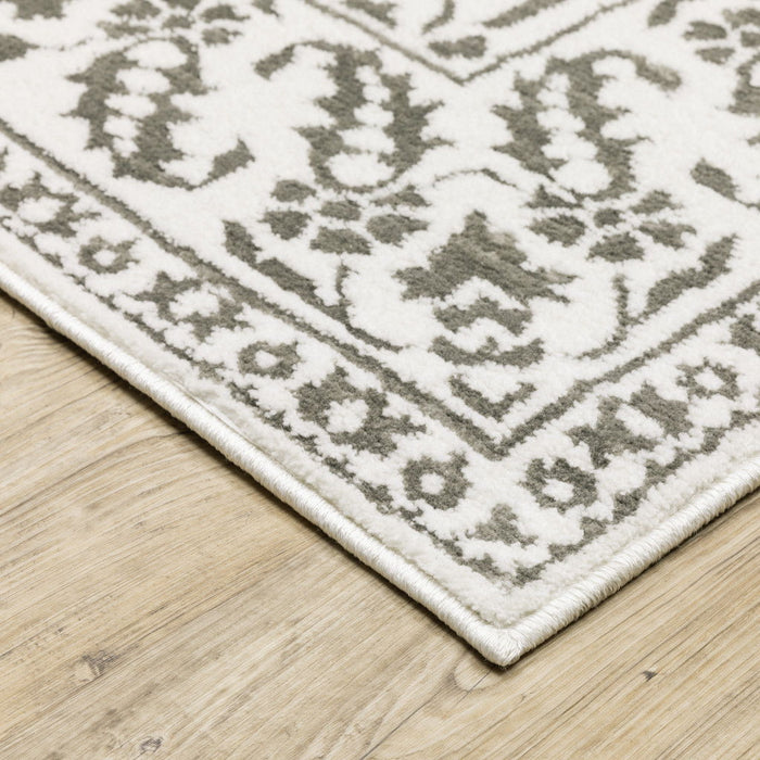 8' x 11' Floral Power Loom Stain Resistant Area Rug - Gray And White