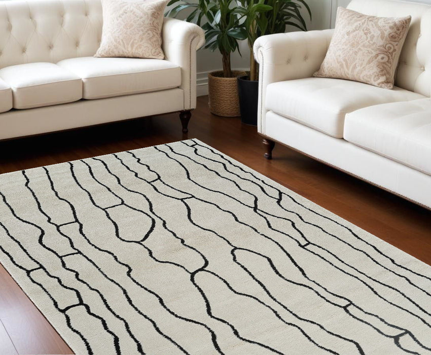 8' x 11' Abstract Distressed Area Rug - Cream And Black