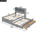 Gray Giga full size platform bed with trundle, drawers, USB ports, and built-in shelves, shown with mattress and bedding.
