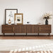 Giga walnut TV stand for up to 85-inch TVs with fluted door, cable management, and soft-closing hinges in a modern living room setting.