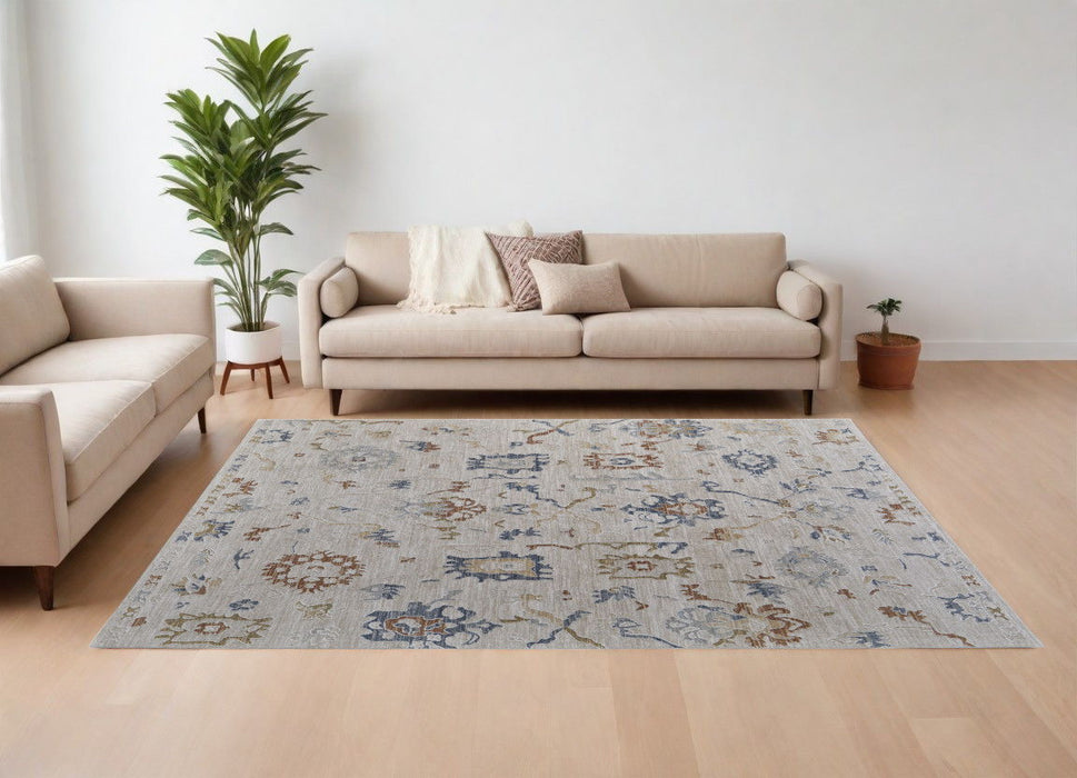 8' x 10' Floral Power Loom Worn Faded Area Rug With Fringe - Ivory Blue And Gold