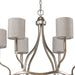 HomeRoots gold metal chandelier with six candle-style lights and white shades, dimmable for elegant lighting.