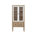 Bernards Furniture display bookcase in sand color, showcasing multiple shelves for storage and display.