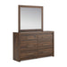 Signature Design by Ashley six-drawer dresser with sleek wood finish and modern hardware, offering ample storage space.