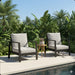 Set of two Giga all-weather ergonomic patio armchairs with thick cushions, ideal for outdoor seating and relaxation.