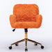 Giga swivel office chair with artificial rabbit hair upholstery, metal base, adjustable height, and caster wheels for home or vanity use.